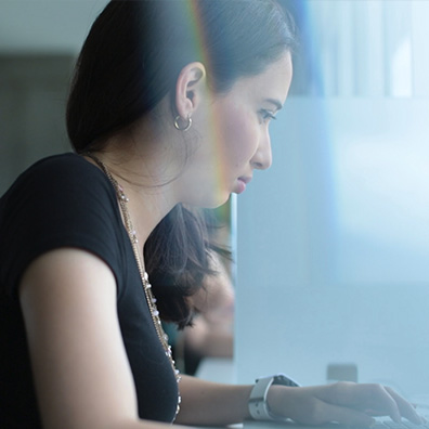 Female Agile Software Developer working at desk