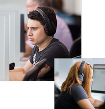 Male and female Agile software developers at working at computers wearing headphones